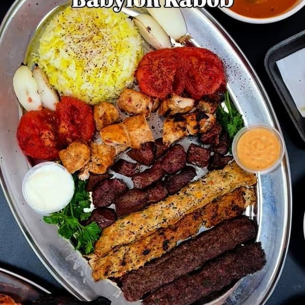 Family platter of kabob, tikka, tawook and saffron rice