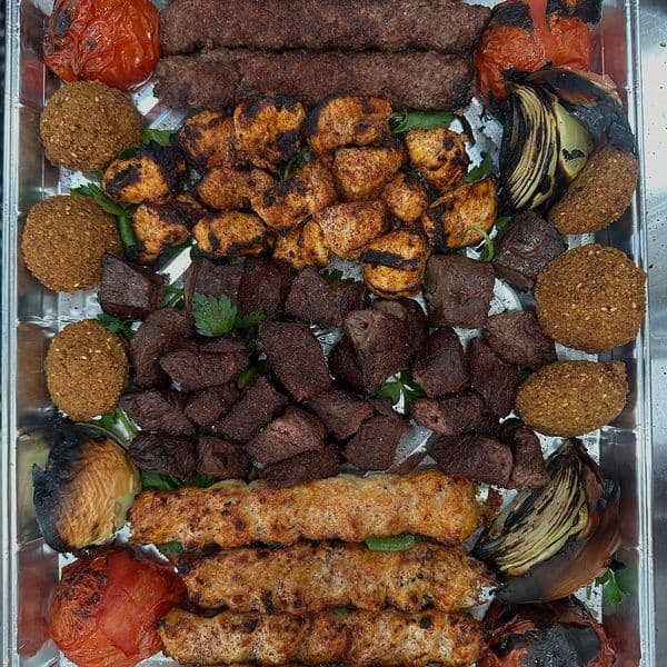 Catering platter of kabobs, tikka and falafel